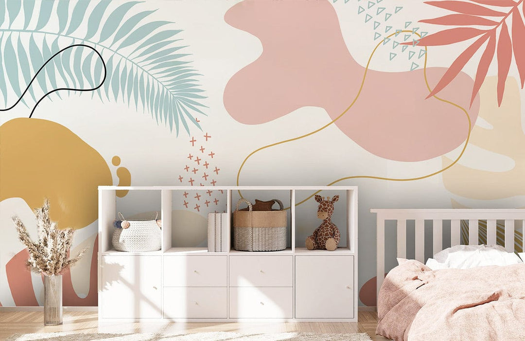 Tropical botanical pastel wallpaper in peach and sage tones, kids' room, white furniture, wooden flooring.