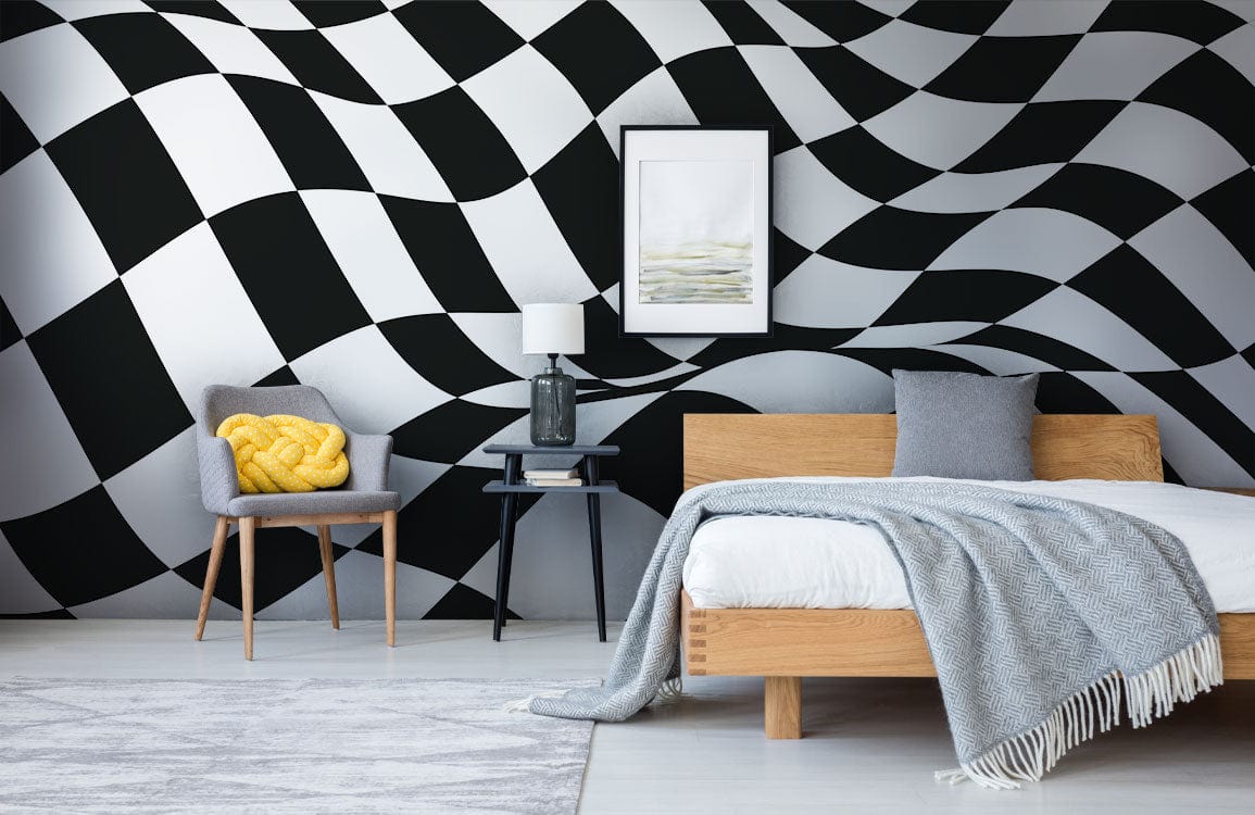 Abstract black and white checkered optical illusion wall mural in modern bedroom with grey accents.