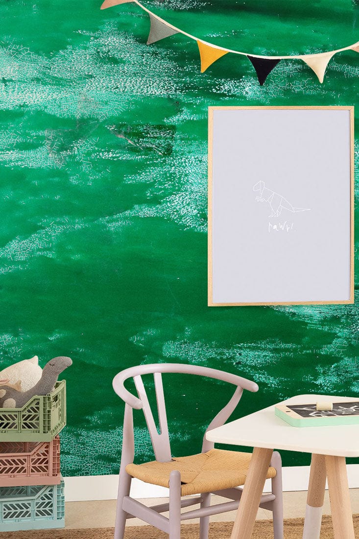 Emerald green textured wallpaper, modern child's room, wooden chair, playful decor, vibrant contemporary design.