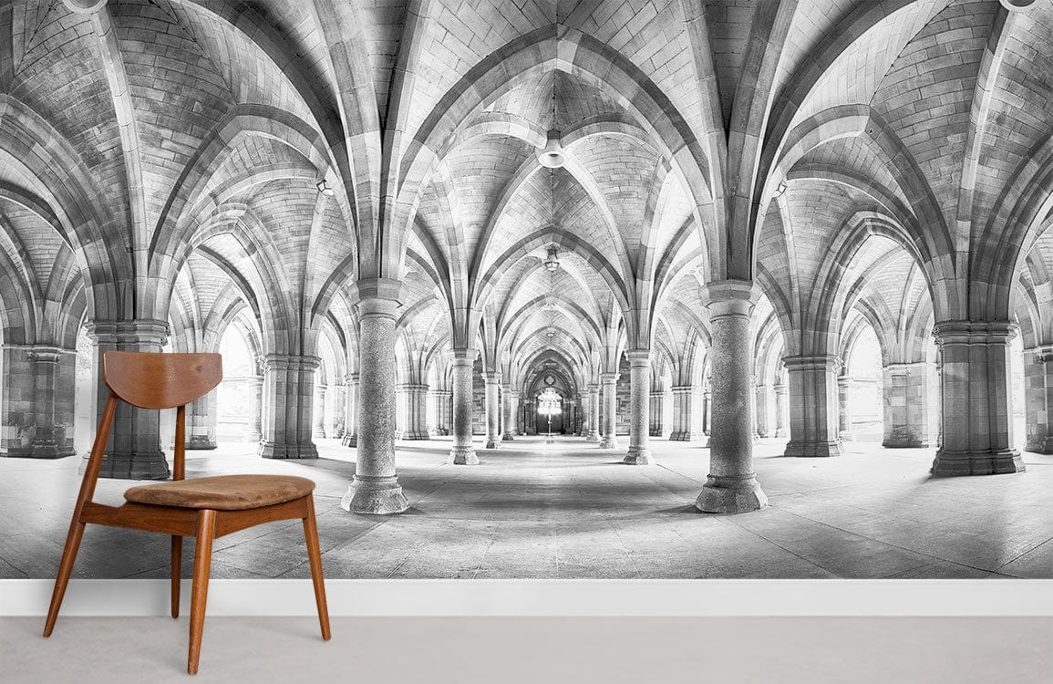 Elegant Gothic wallpaper mural with vaulted arches, placed in room with minimalist wooden chair.