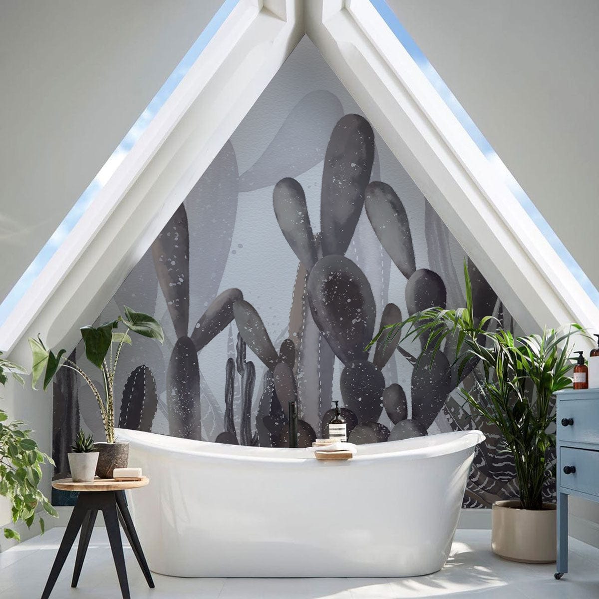 Desert Oasis Grey Cactus Mural Wallpaper in modern bathroom, white bathtub, complementing plant decor.