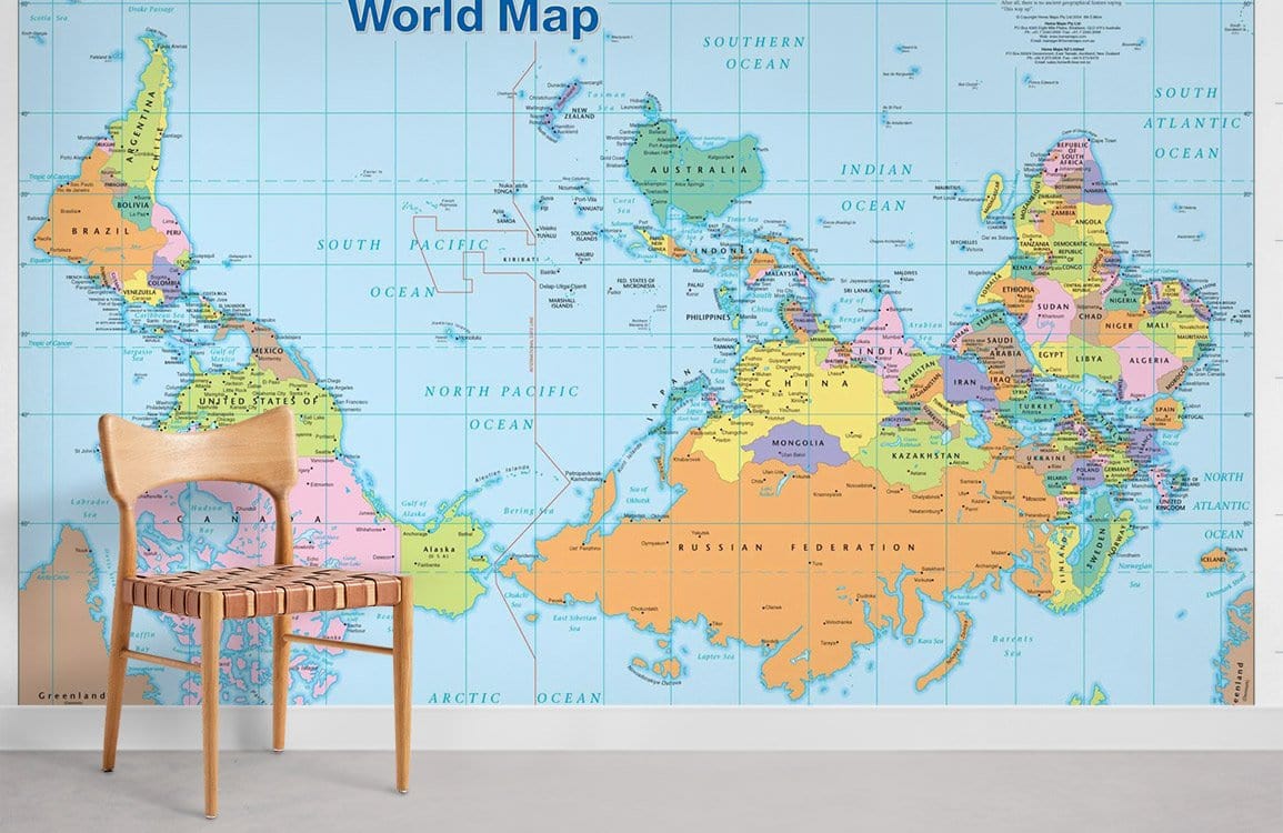 Vibrant Upside Down World Map Mural Wallpaper with wooden chair, grey floor, educational blue decor.
