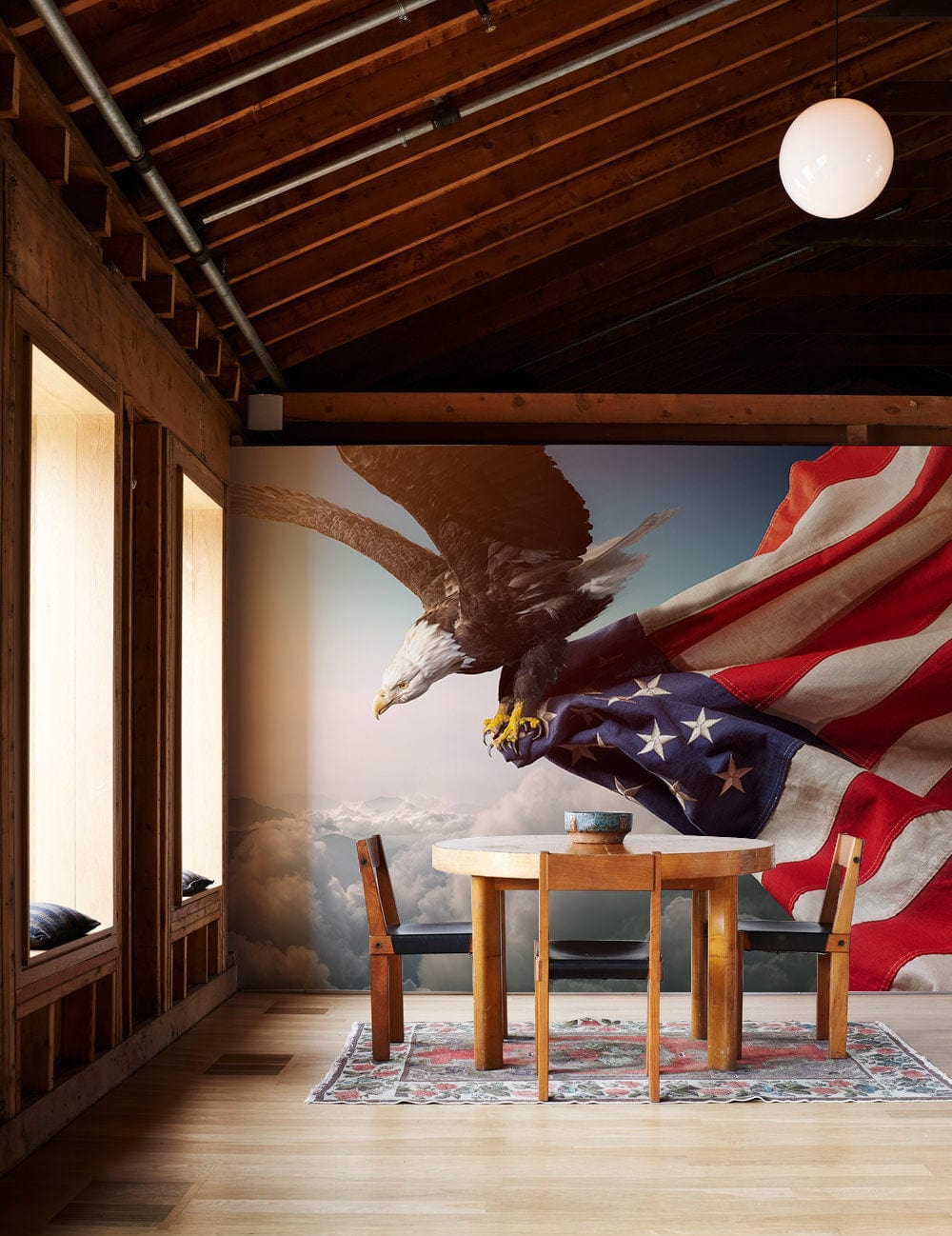 Majestic Bald Eagle Flag Mural Wallpaper in rustic room with wooden dining set and patterned rug.