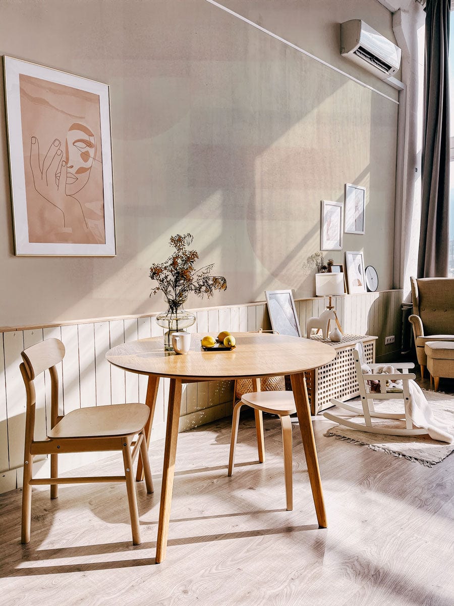Subtle Geometric Pastel Abstract Pattern Wallpaper complements Scandinavian dining room with wooden table and chairs.