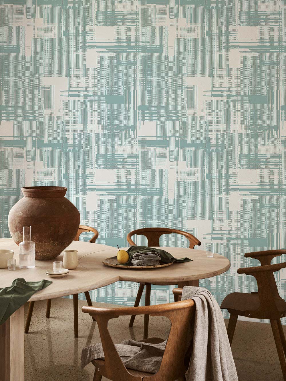 Mint geometric abstract wallpaper, modern dining room with wooden table, chairs, textured walls, stylish interior.
