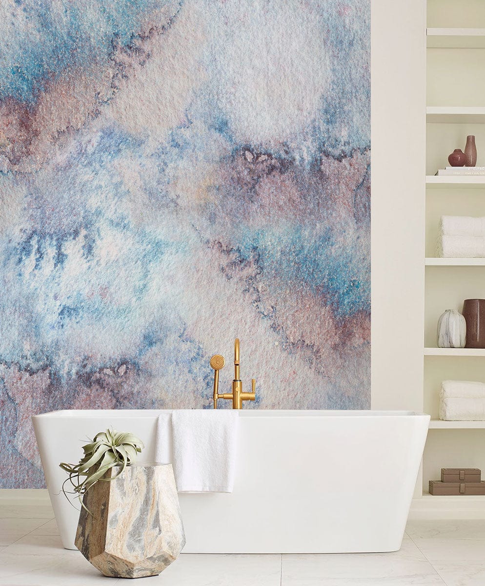 Abstract wallpaper in blue and earth tones, white bathtub, cream shelves, modern bathroom design.