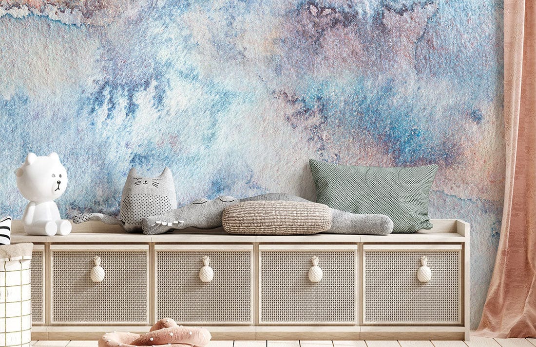 Alt text: Blue abstract wallpaper, beige bench, cushioned toys, pastel decor, light wood floor, tranquil room setting.