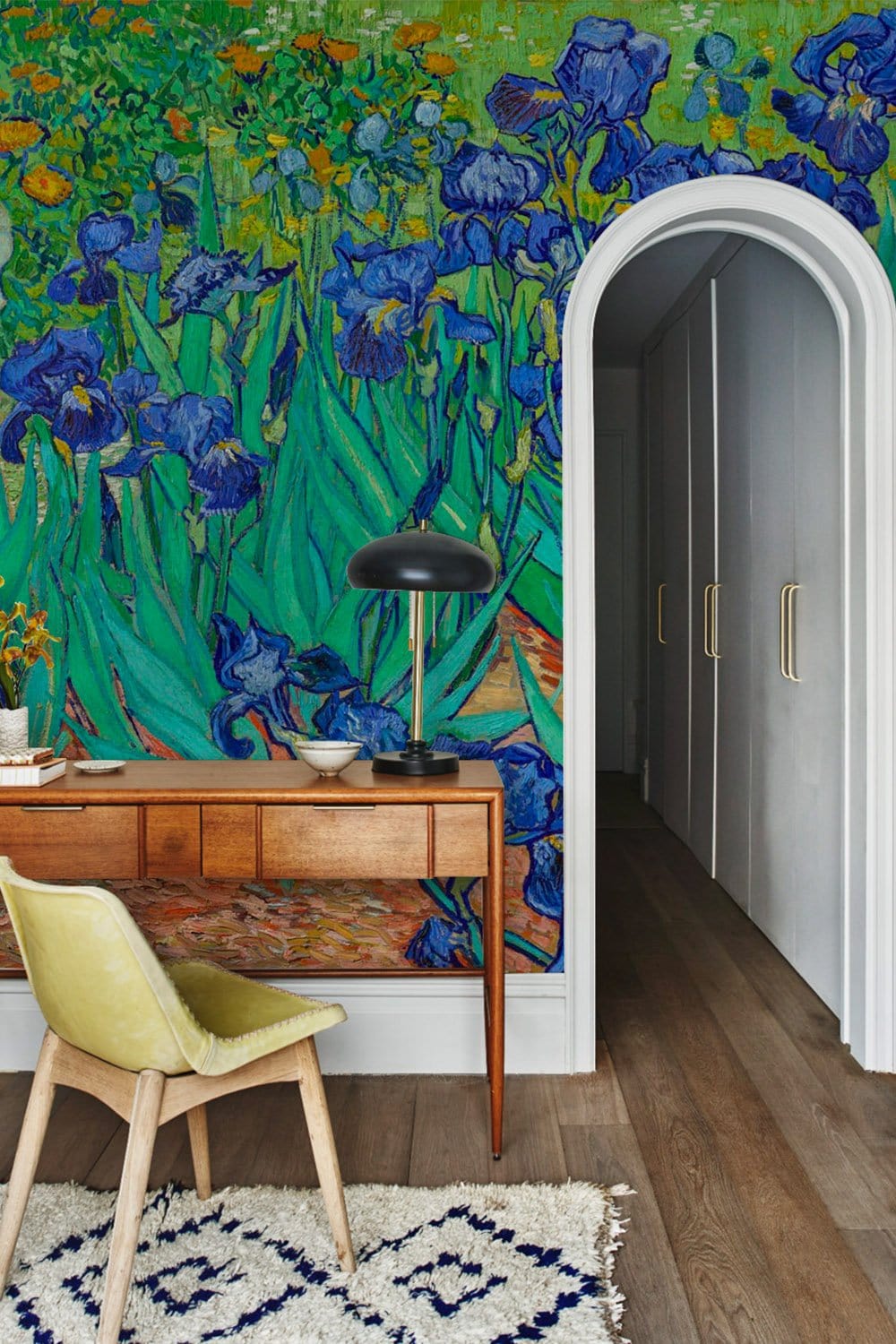 Vibrant Blue Irises Mural Wallpaper in hallway with wooden desk, yellow chair, hardwood flooring.