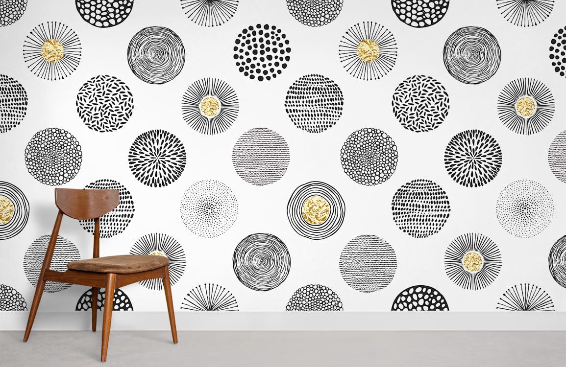 Monochrome geometric circles wallpaper with gold accents, wooden chair, modern minimalist room setting.