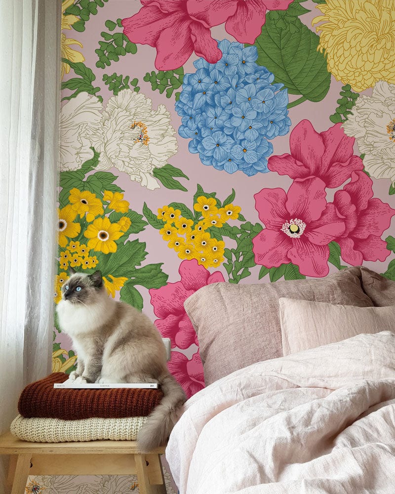 Vibrant floral wallpaper with colourful botanical pattern, cosy bed, and cat in stylish interior setting.