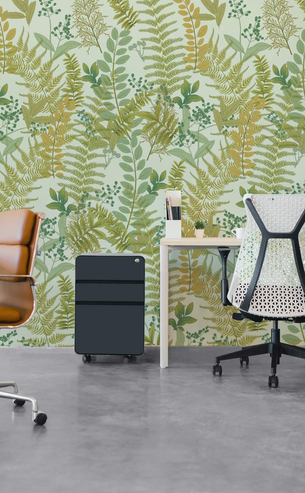 Office featuring Botanical Fern Wallpaper, earthy tones; modern chairs, concrete flooring, white desk.