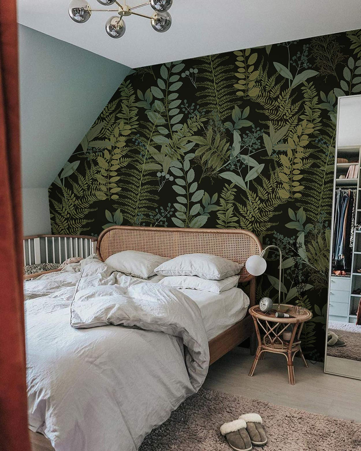 Green Botanical Fern Pattern Wallpaper in bedroom with wooden bed, grey flooring, and mirrored wardrobe.