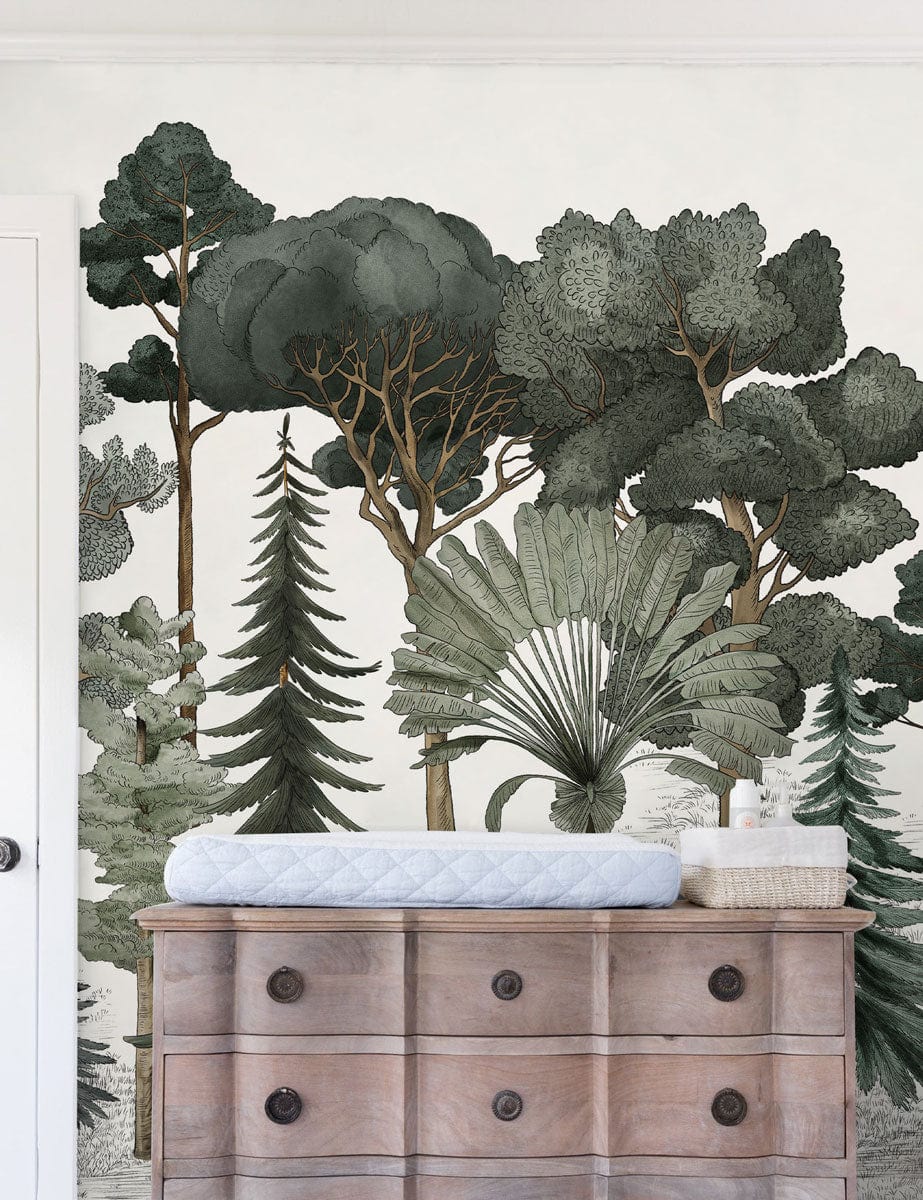 Enchanted Forest Green Mural Wallpaper behind wooden dresser in nature-inspired room. Wall art decor.