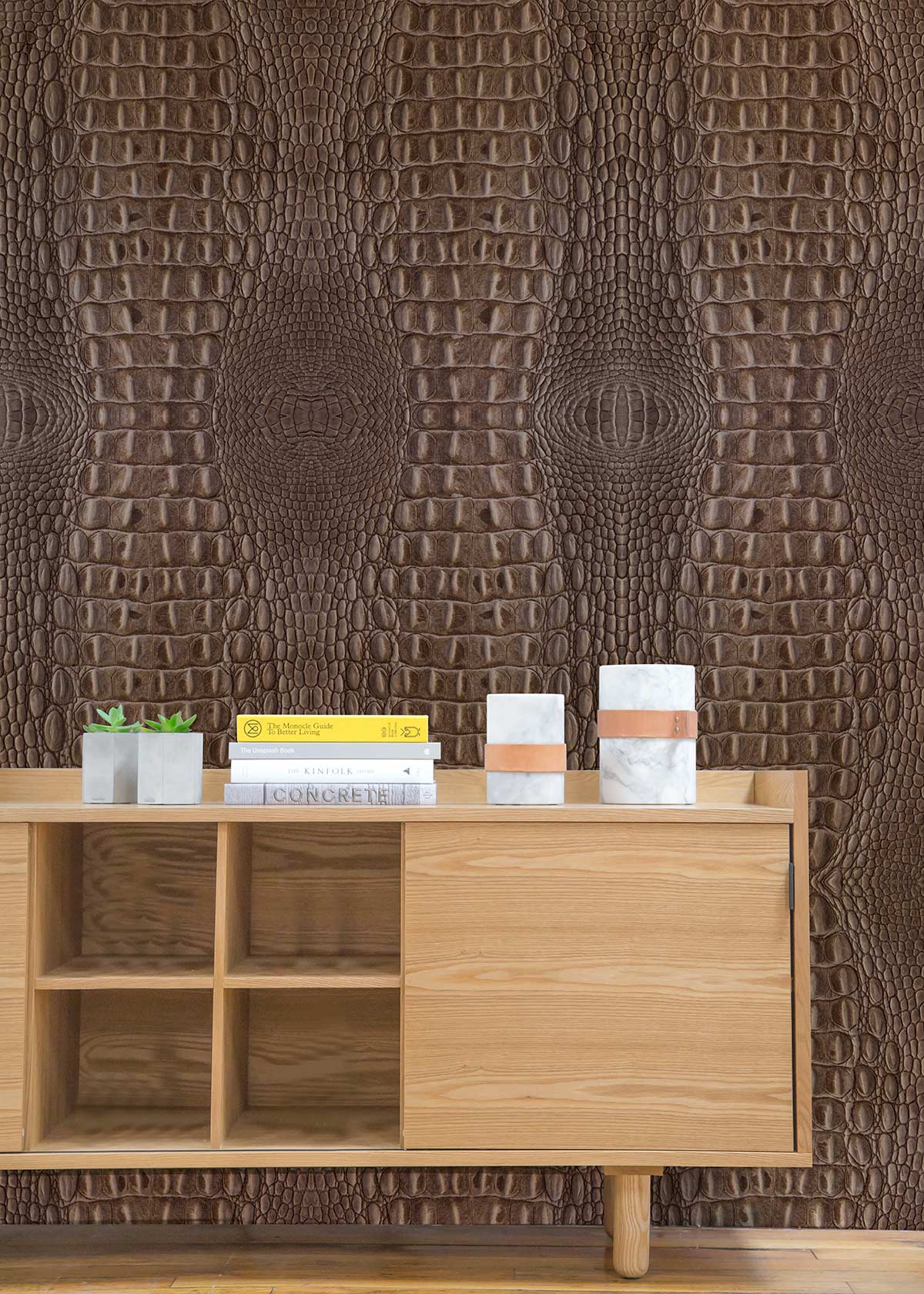 Elegant brown crocodile textured wallpaper in modern living room with wooden sideboard on oak floor.