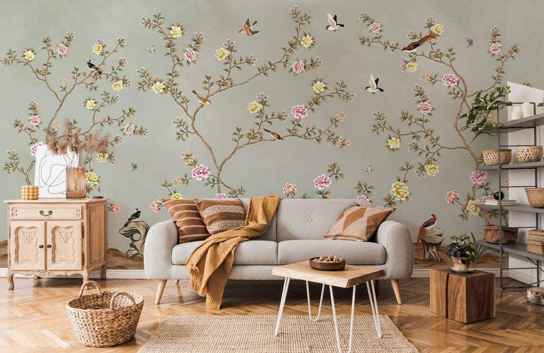 Vintage Chinoiserie floral mural wallpaper, pastel green with birds, blossom, grey sofa, parquet flooring.