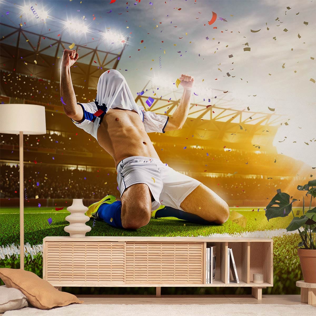 Dynamic football mural wallpaper in living room, wooden console, beige sofa, vibrant sporty atmosphere.
