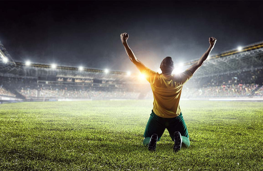 Triumphant Football Stadium Mural Wallpaper: Inspiring Sports Enthusiast Decor Design