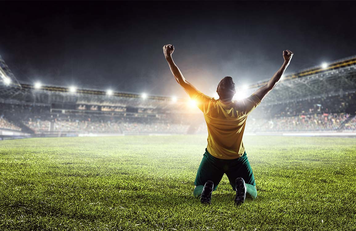 Triumphant Football Stadium Mural Wallpaper: Inspiring Sports Enthusiast Decor Design
