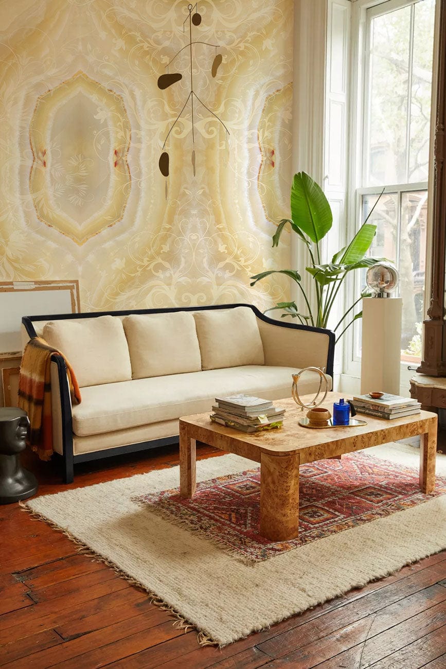 Elegant cream marble wallpaper in pastel tones, beige sofa, rustic wooden flooring, modern living room.