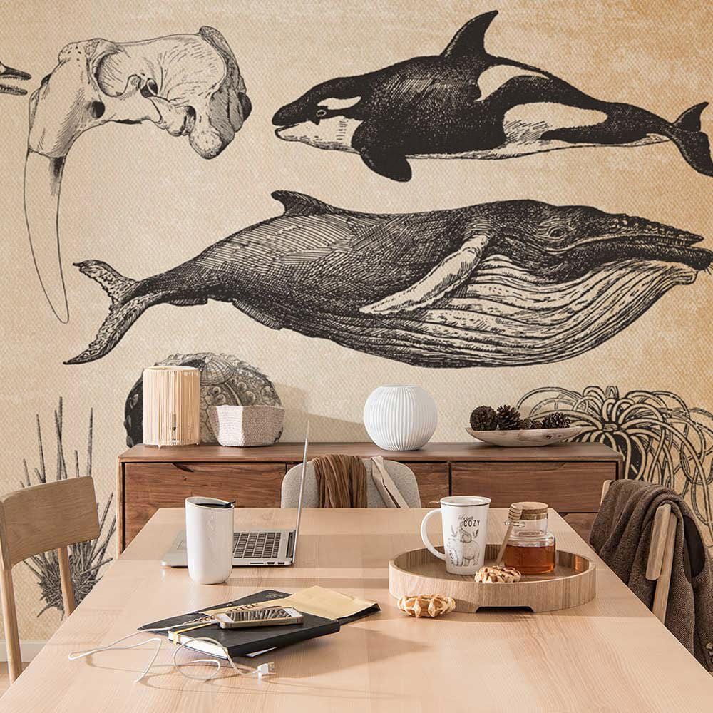 Sepia-toned marine life mural wallpaper with dining table, wooden chairs, laptop, and neutral decor items.