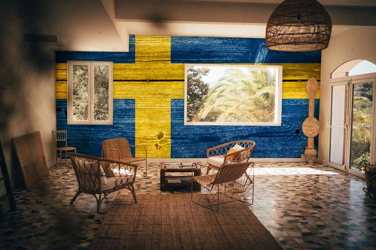 Rustic living room featuring Swedish flag woodgrain wallpaper, wicker furniture, and patterned tiled flooring.