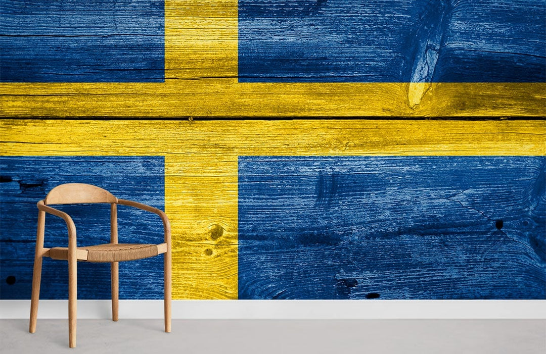 Swedish flag wallpaper mural with rustic woodgrain; features wooden chair, minimalistic decor.