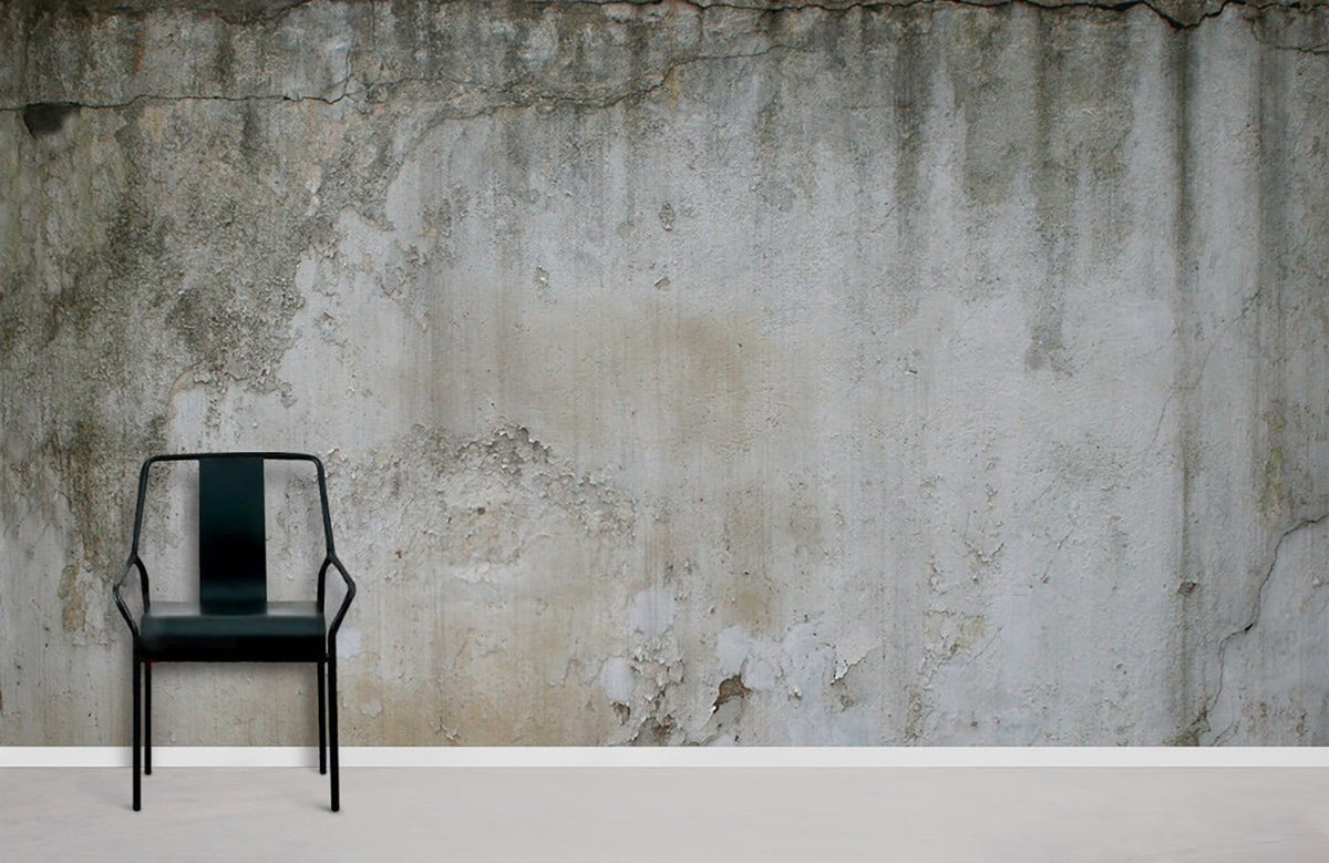 Rustic concrete effect wallpaper, earthy tones; black metal chair; neutral flooring; minimalist design style.
