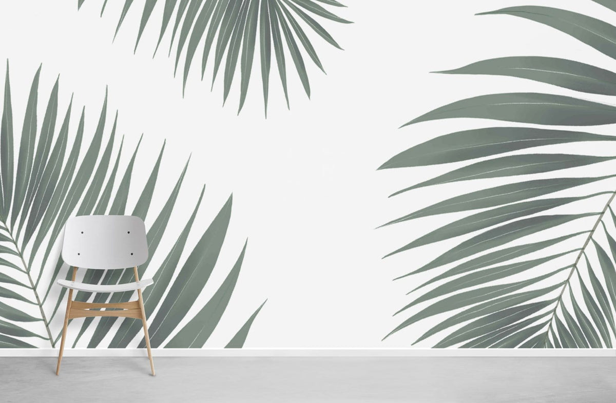 Tropical palm leaf wallpaper in green, minimalist design with modern white chair on grey flooring.