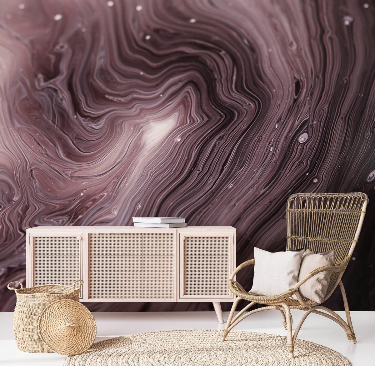 Elegant Swirling Marble Wallpaper in mauve, cream with natural woven chair, sideboard, and rug.