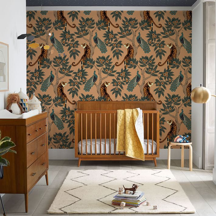 Nursery with Tropical Tiger and Peacock Mural Wallpaper, wooden furniture, white rug, hardwood flooring.