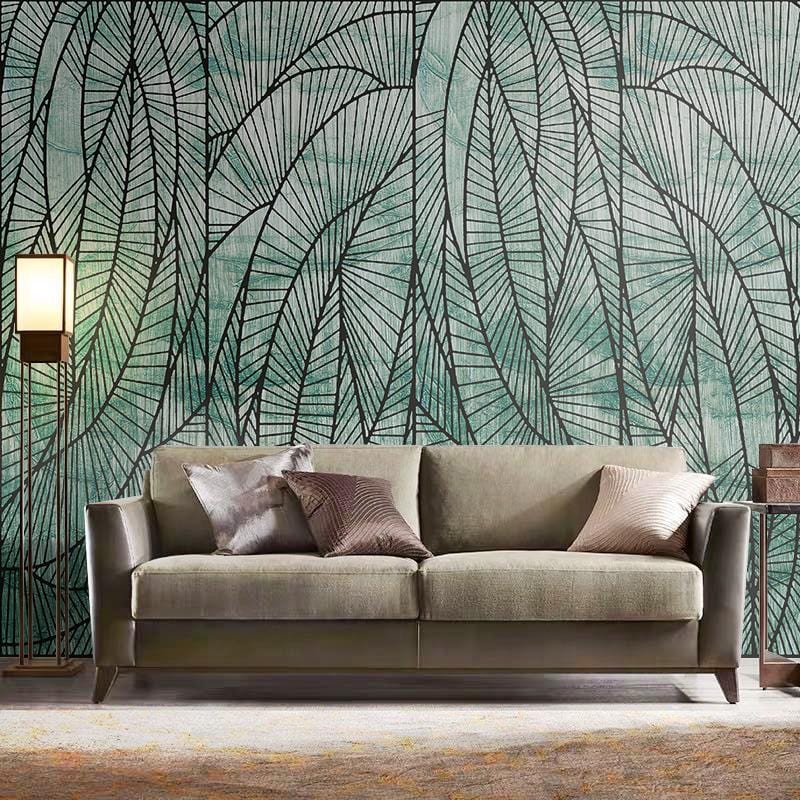 Emerald green geometric leaf wallpaper, modern interior, grey sofa, light wood flooring, floor lamp.