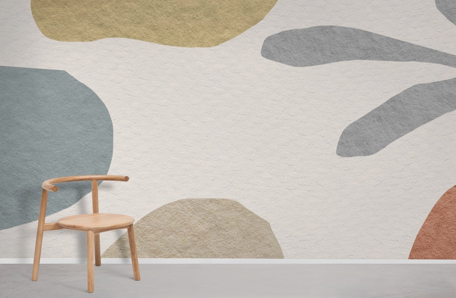 Muted pastel abstract wallpaper with textures in modern interior, wooden chair, neutral flooring.