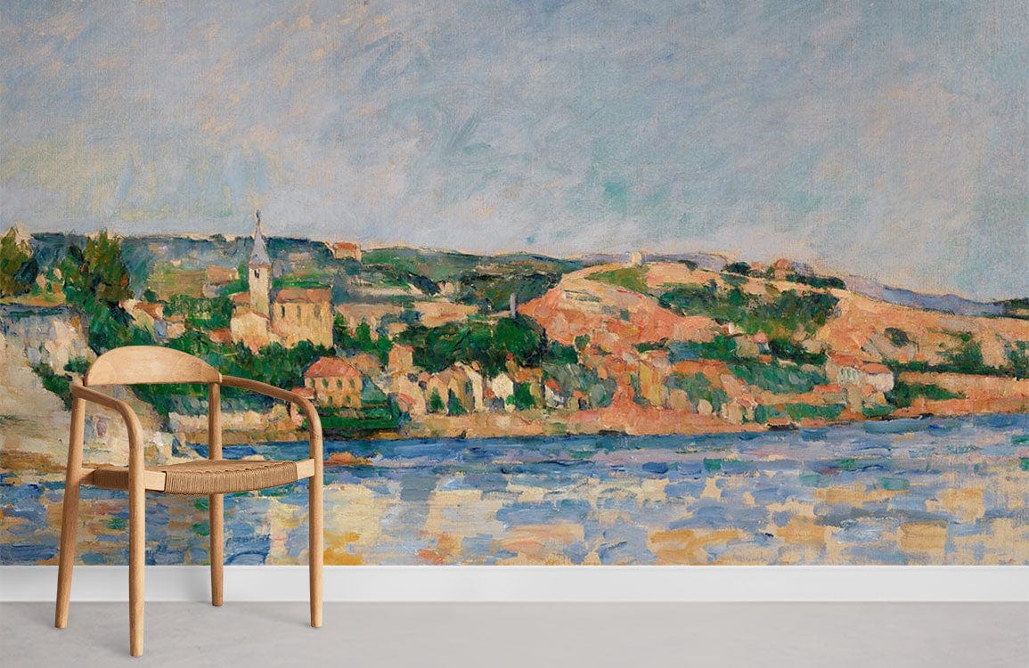 Impressionist coastal landscape mural wallpaper in serene blues, earthy tones; minimalist wooden chair, grey flooring.