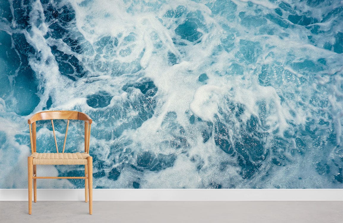 Ocean wave mural in blue watercolour with wooden chair, grey carpet, contemporary style room.