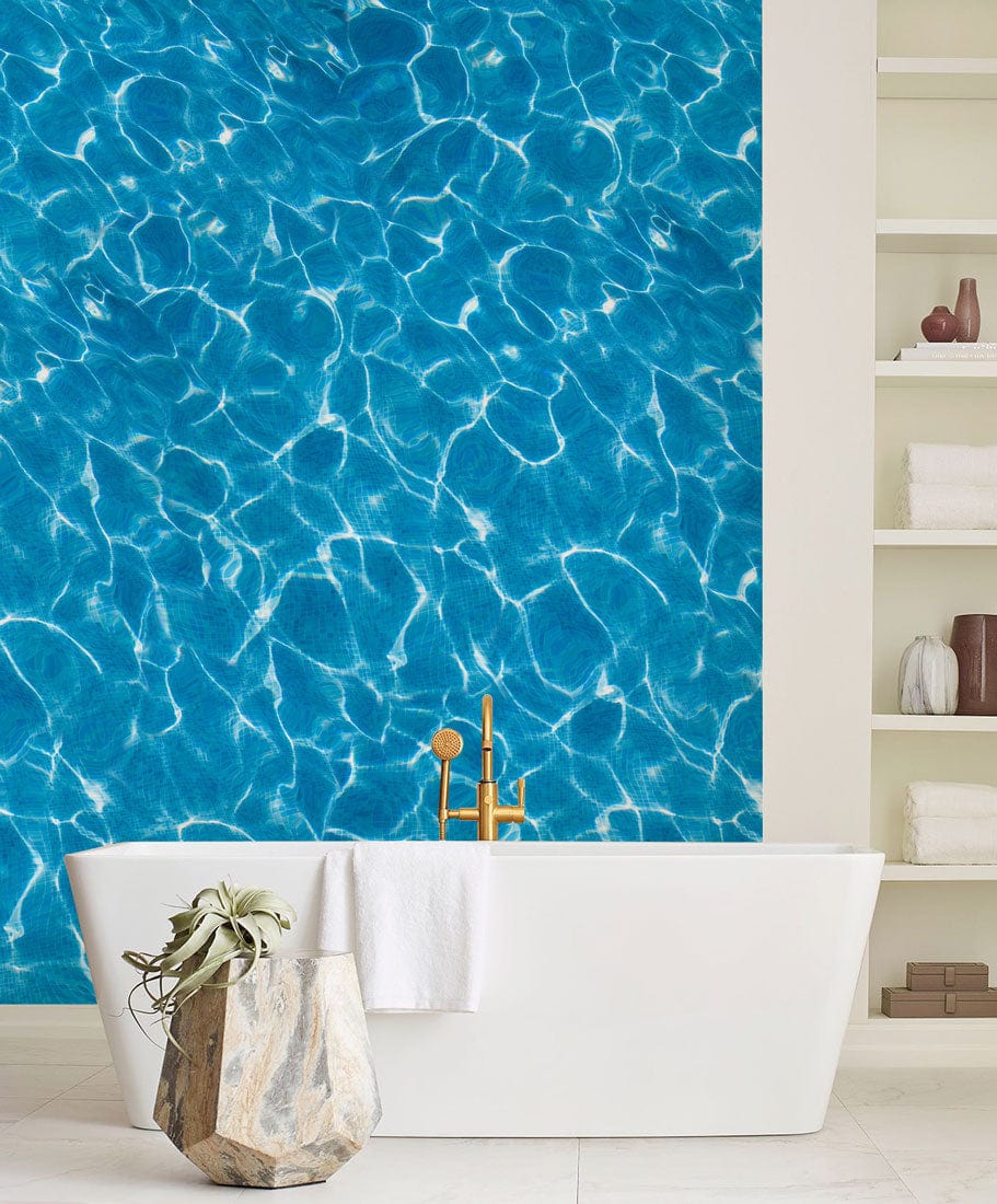 Vibrant Blue Water Ripple Wallpaper, elegant bathroom setting with white bathtub, modern shelving.