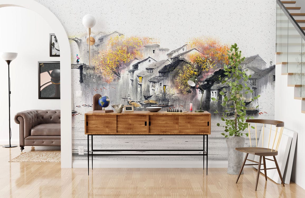 Tranquil Watercolour Landscape Mural Wallpaper, autumn village style, with brown sofa, wooden flooring, console.