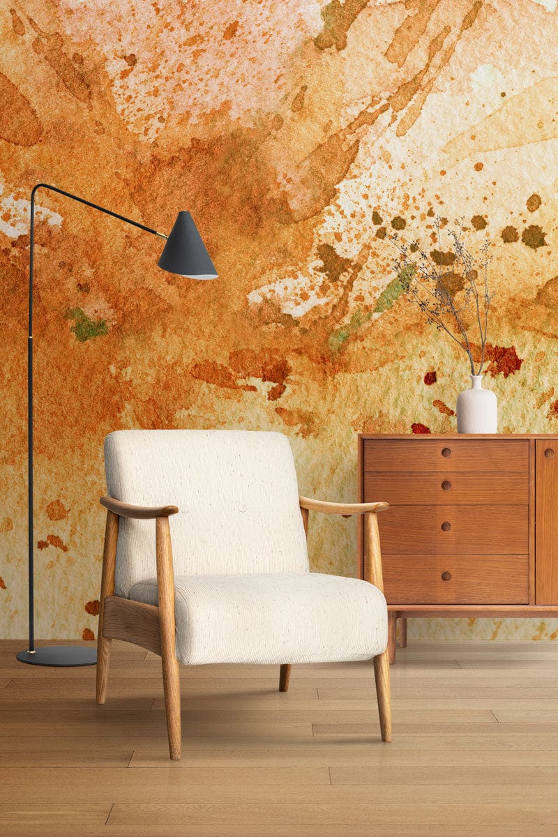 Rustic Watercolour Splatter Orange Mural Wallpaper, Scandinavian chair, wooden floors, minimalistic lamp, mid-century dresser.