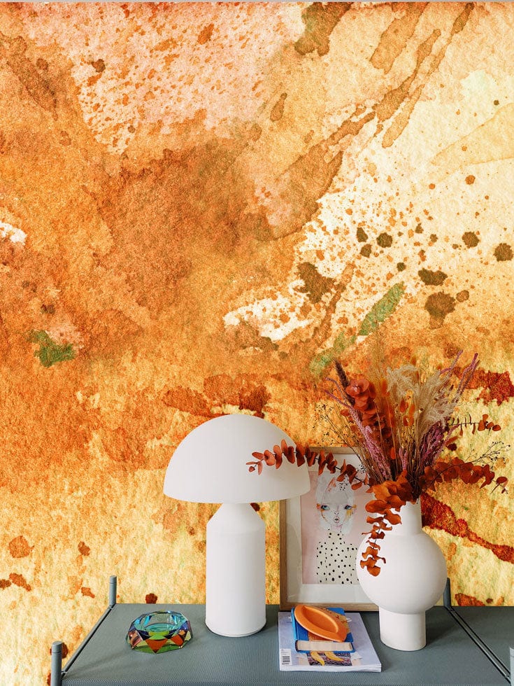 Rustic Watercolour Splatter Orange Mural Wallpaper adorns feature wall, complemented by modern white lamp decor.