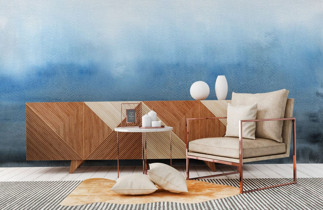 Tranquil Blue Watercolour Gradient Mural Wallpaper, modern sofa, geometric sideboard, contemporary living area decor.