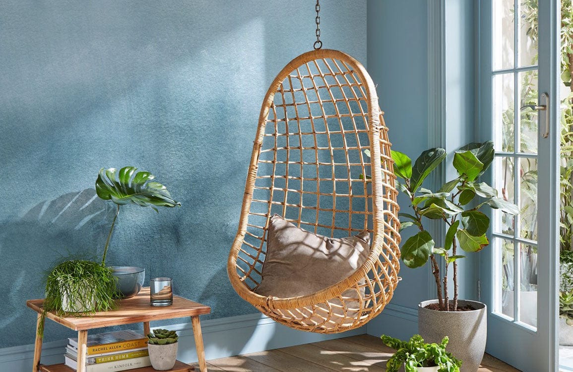 Hanging chair, Serene Watercolour Misty Blue Ombre Landscape Mural Wallpaper, wooden floor, blue walls.