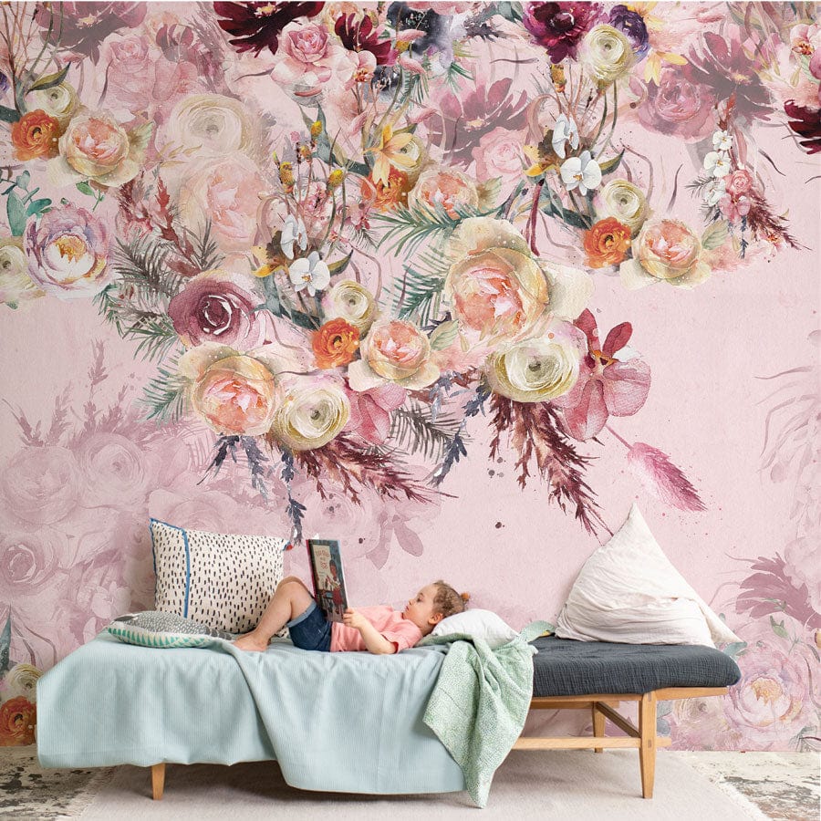 Child relaxing in front of Floral Elegance vintage wallpaper with roses, in cosy living room setting.