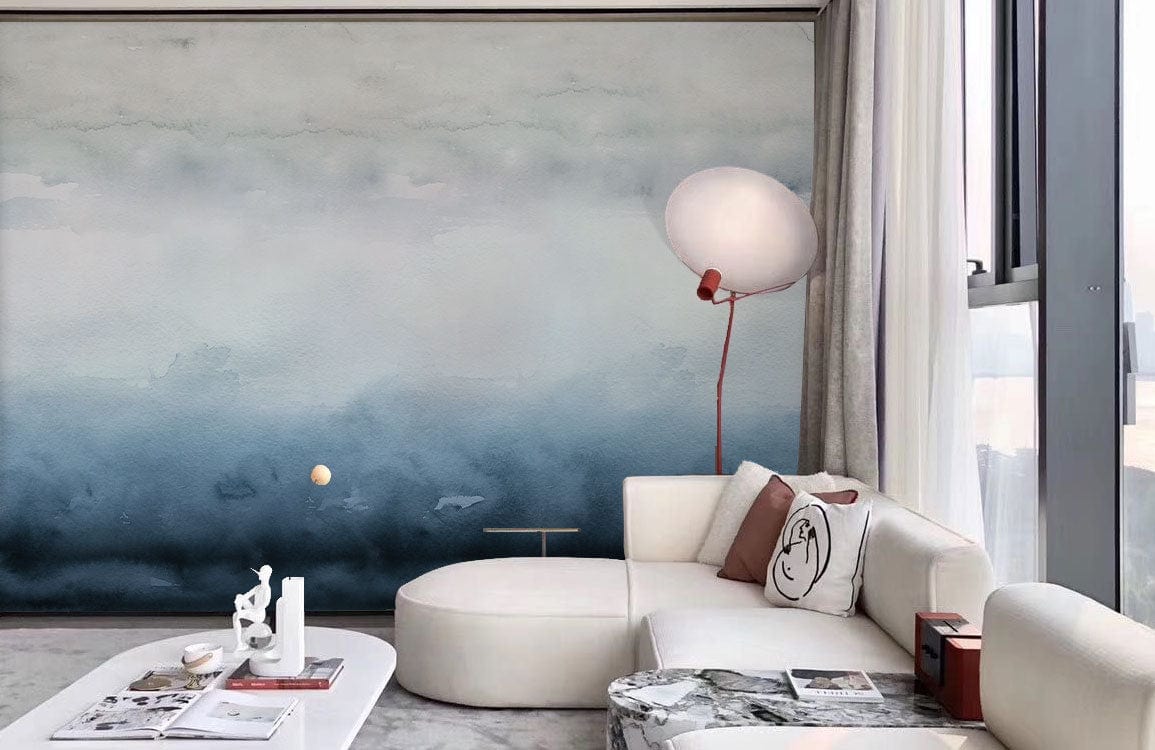 Tranquil Misty Blue Watercolour Ombre Wallpaper in serene living room with white sofa and modern lamp.