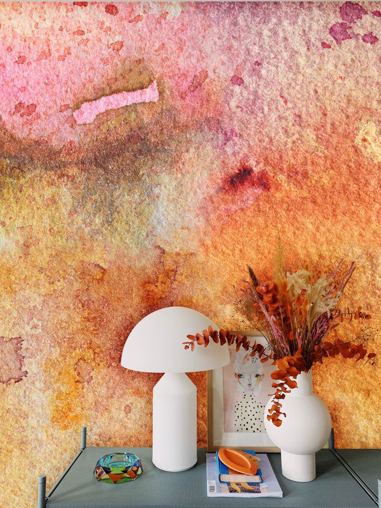 Abstract Watercolour Sunset Bliss mural with warm tones, modern vases, and sleek table decor accents.