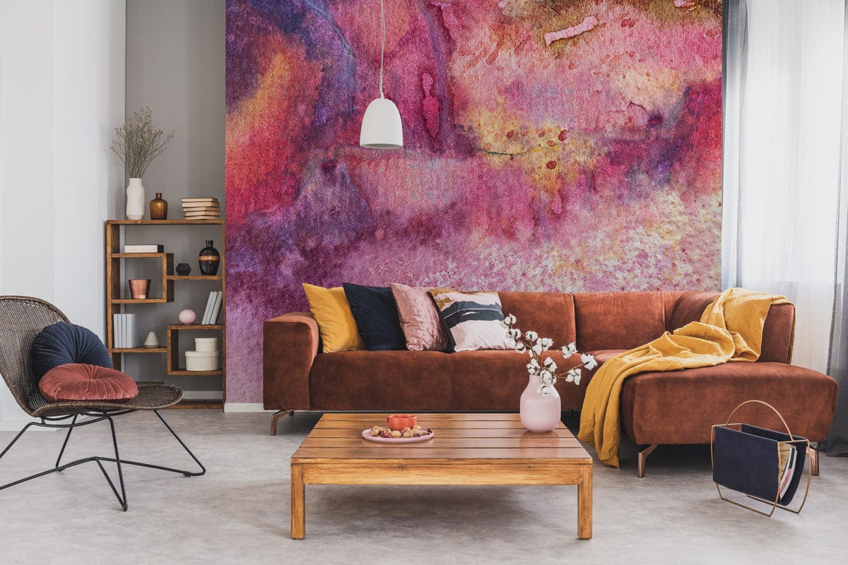 Abstract watercolour wallpaper in sunset tones, brown sofa, wooden coffee table, modern lamp, living room.