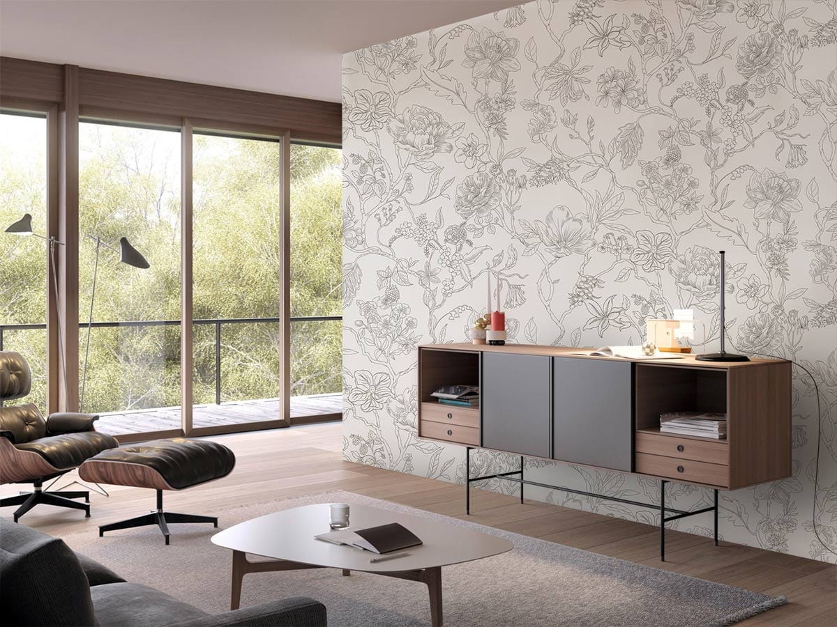 Elegant grey botanical wallpaper in modern living room with wooden flooring, stylish chair, and cabinet.