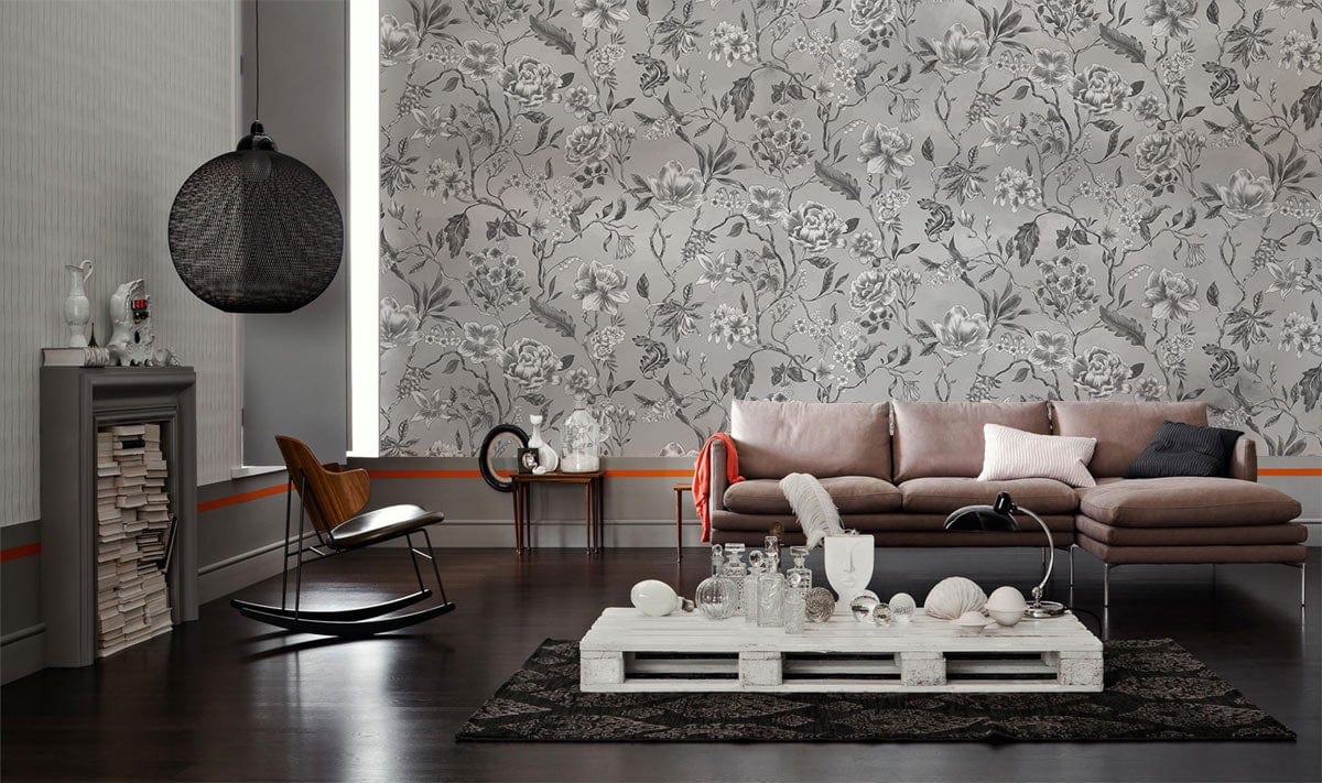 Elegant grey floral wallpaper, vintage living room, brown modern sofa, dark wood flooring, stylish decor.