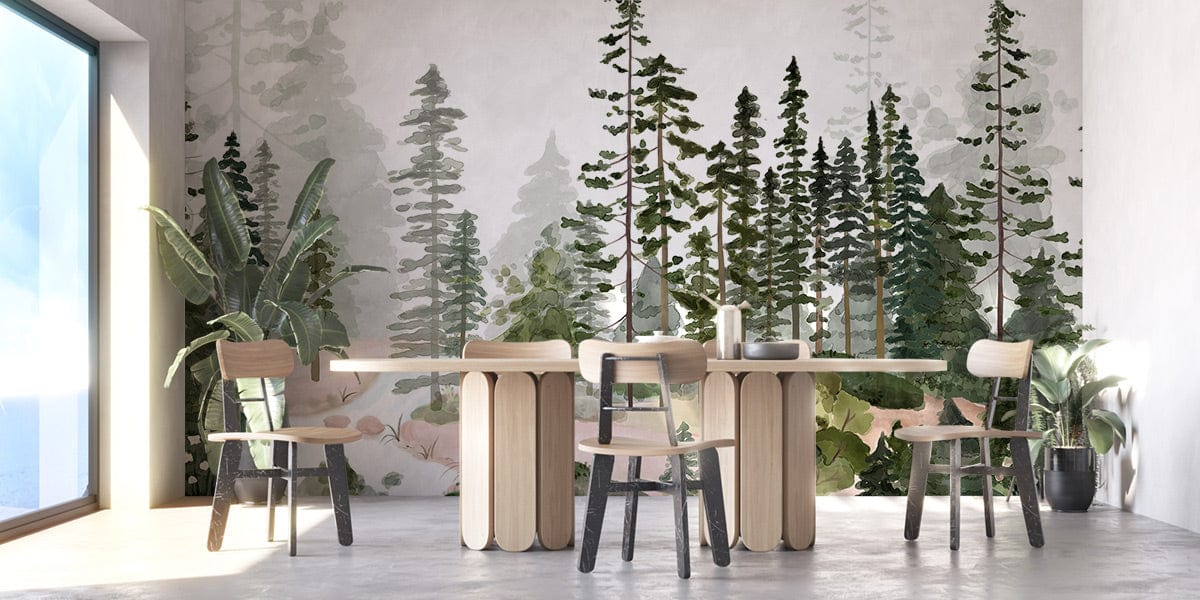 Dining room with serene forest watercolour mural wallpaper, light wood table, chairs, soft green tones.