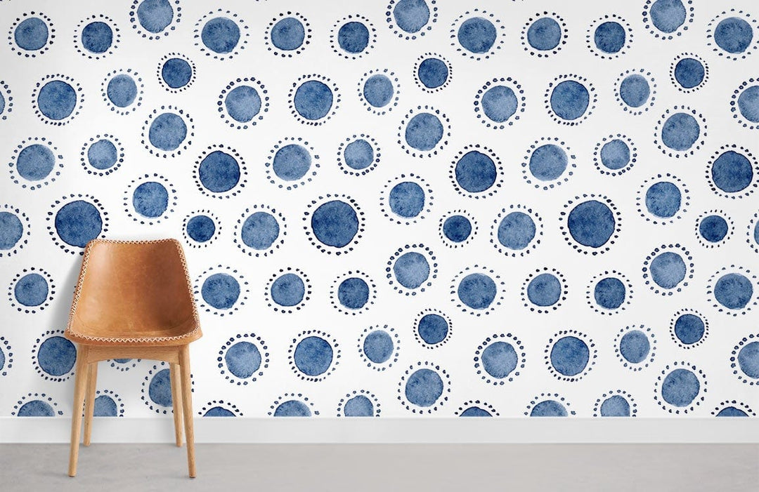 Navy Blue Watercolour Polka Dot Wallpaper with modern chair in stylish interior, grey flooring visible.
