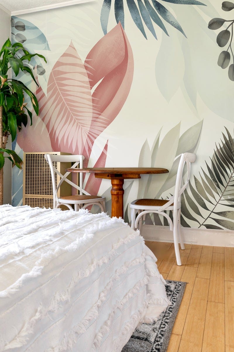 Elegant Pastel Leaves Mural Wallpaper with Soft Pink and Blue, wood table, white chairs, bedroom decor.
