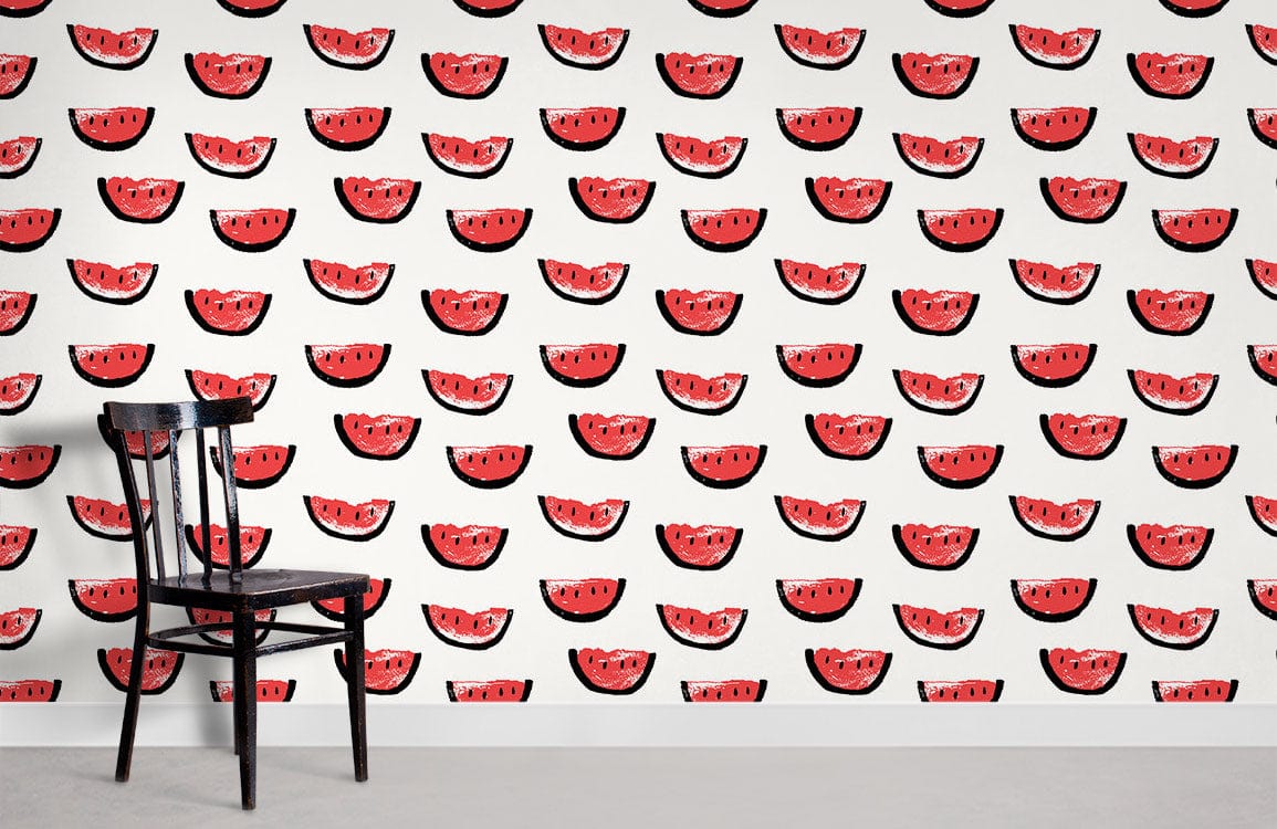 Playful red watermelon pattern wallpaper with black chair, perfect for vibrant summer room interiors.